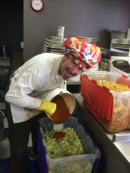 This last full moon ferment was Kimchi Madness! Here we are mixing the magic
kimchi sauce into the cabbage & radish before crocking at our fermatorium in
City Pizza.